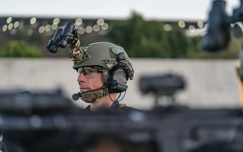 Soldier wearing a tactical headset with boom mic | Chase Tactical | Tactical Gear Soldier Wearing A Tactical Headset With Boom Mic
